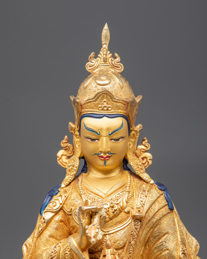 Close-up of 5-jeweled crown and facial details of Guru Rinpoche statue

