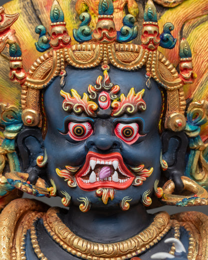 Close-up of Achala Statue face with five-skull crown and wrathful gaze