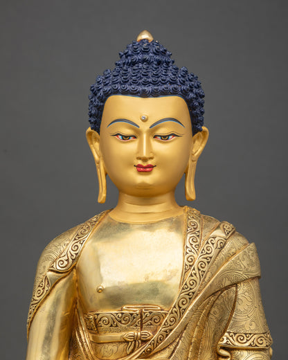 Close-up of Amida Nyorai Buddha statue showing intricate carved monk’s robe details