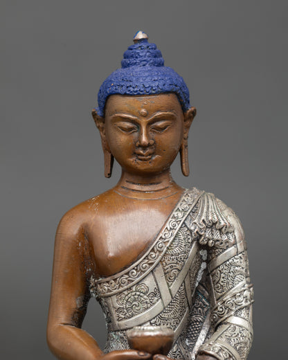 Close-up of Amitabha Buddha Statue face showing serene expression and sacred Himalayan craftsmanship