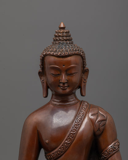 Close-up of Amitabha Buddha face and oxidized copper texture details