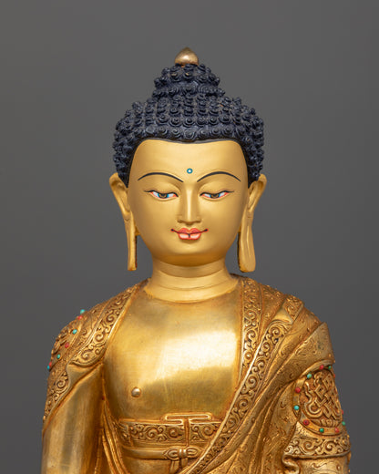 Close-up of Amitabha Buddha’s face and semi-precious stones on auspicious symbols