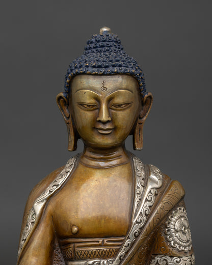 Close-up of Amitabha Buddha statue showing acrylic color detailing and monk’s bowl