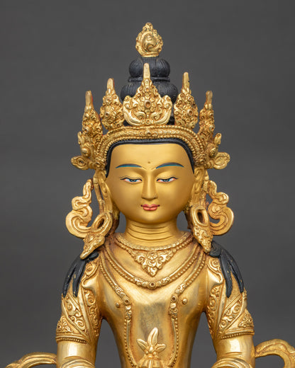 Close-up of Amitayus Bodhisattva face with gold-painted expression, Patan artisan craft