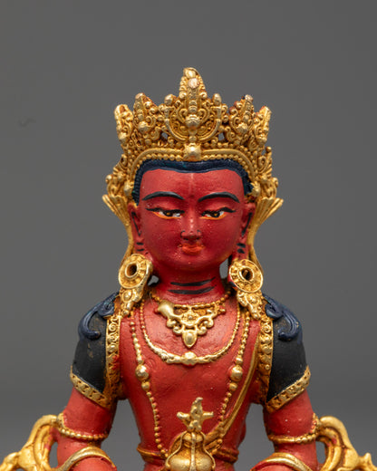Amitayus Buddha face, showcasing serene expression, detailed crown, and hand-painted features with vibrant colors.
