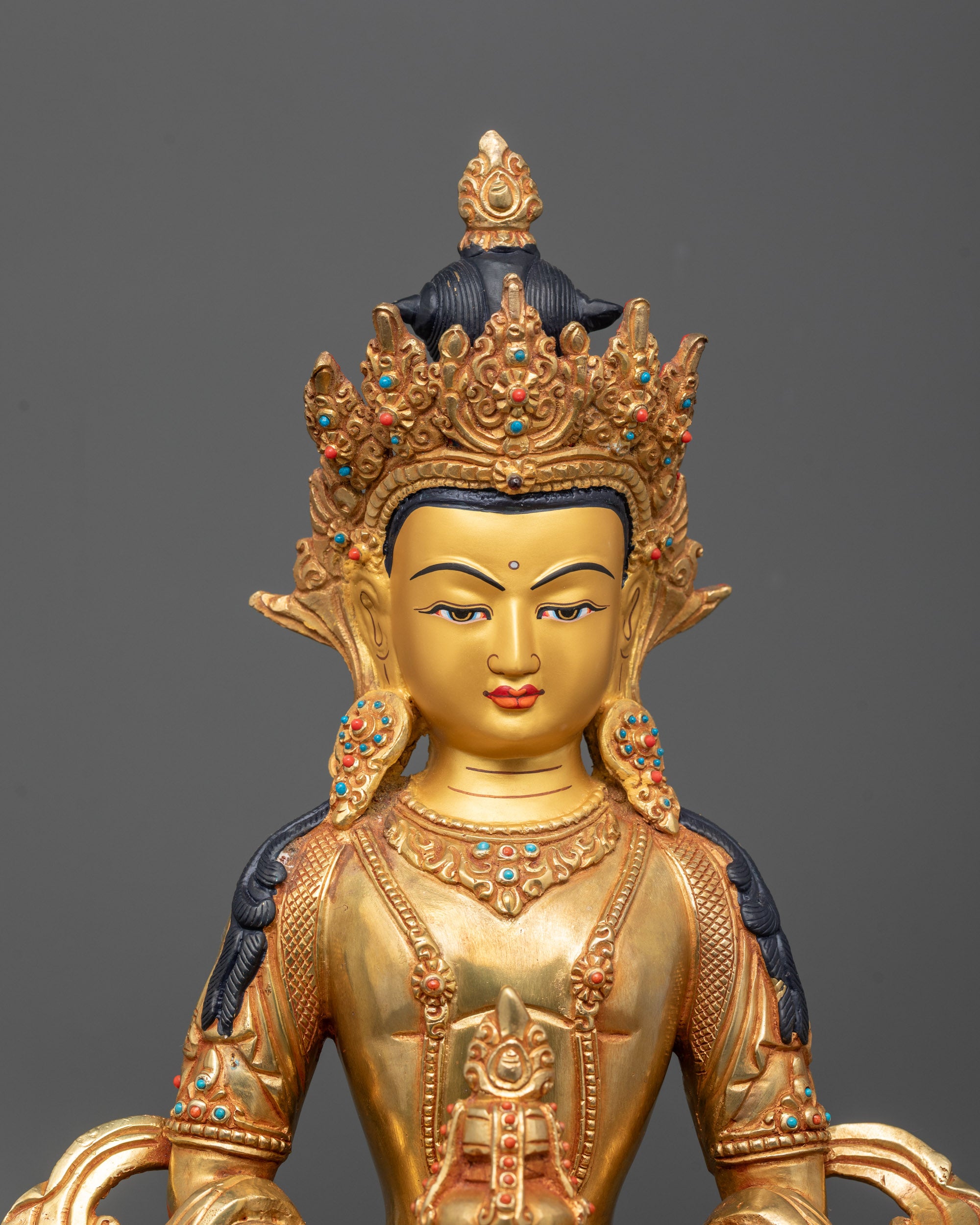Close-up of Amitayus Statue face and kalash with 24k gold detailing