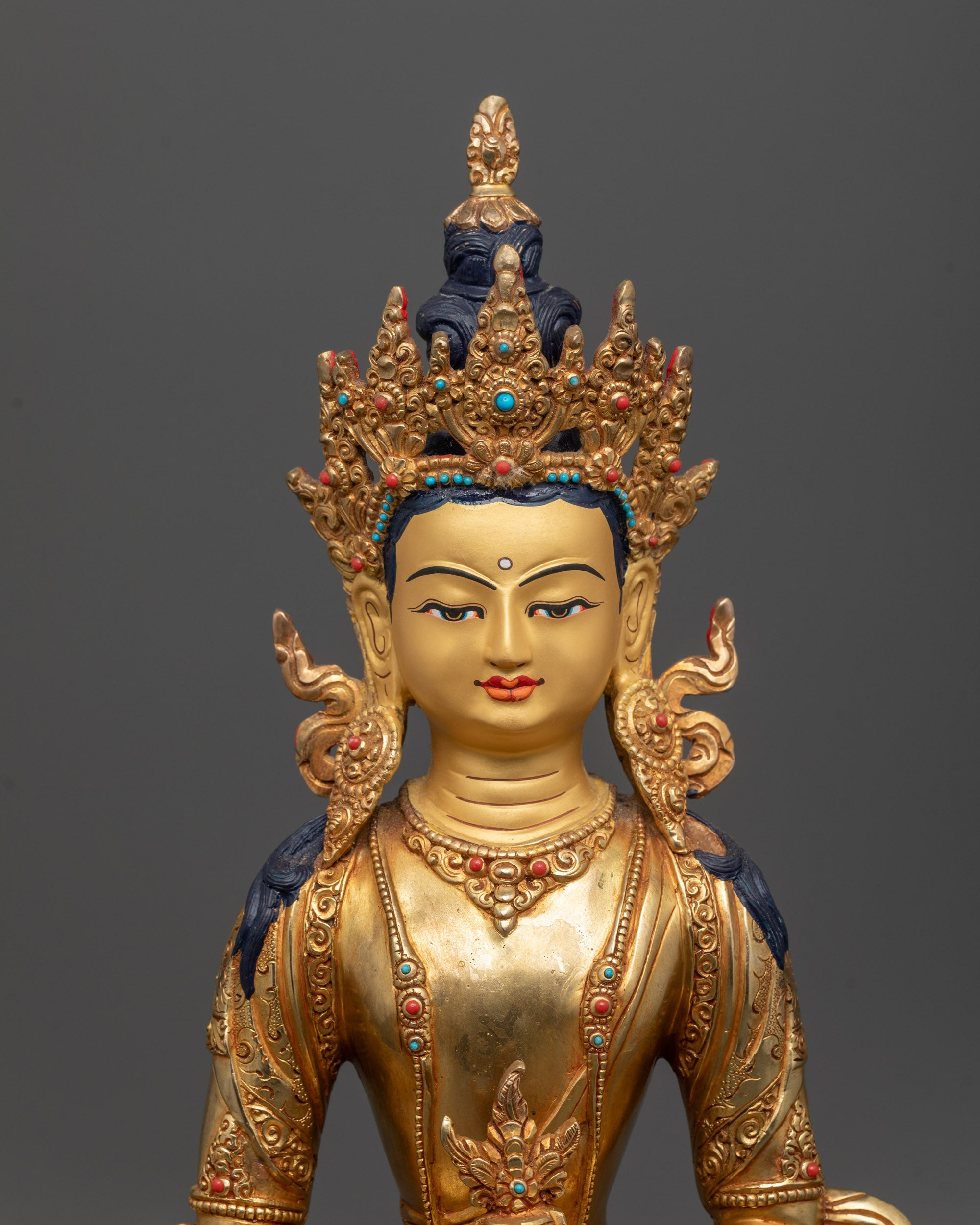 Close-up of Amitayus Statue’s detailed face, five-jewel crown, and kalash held in hands