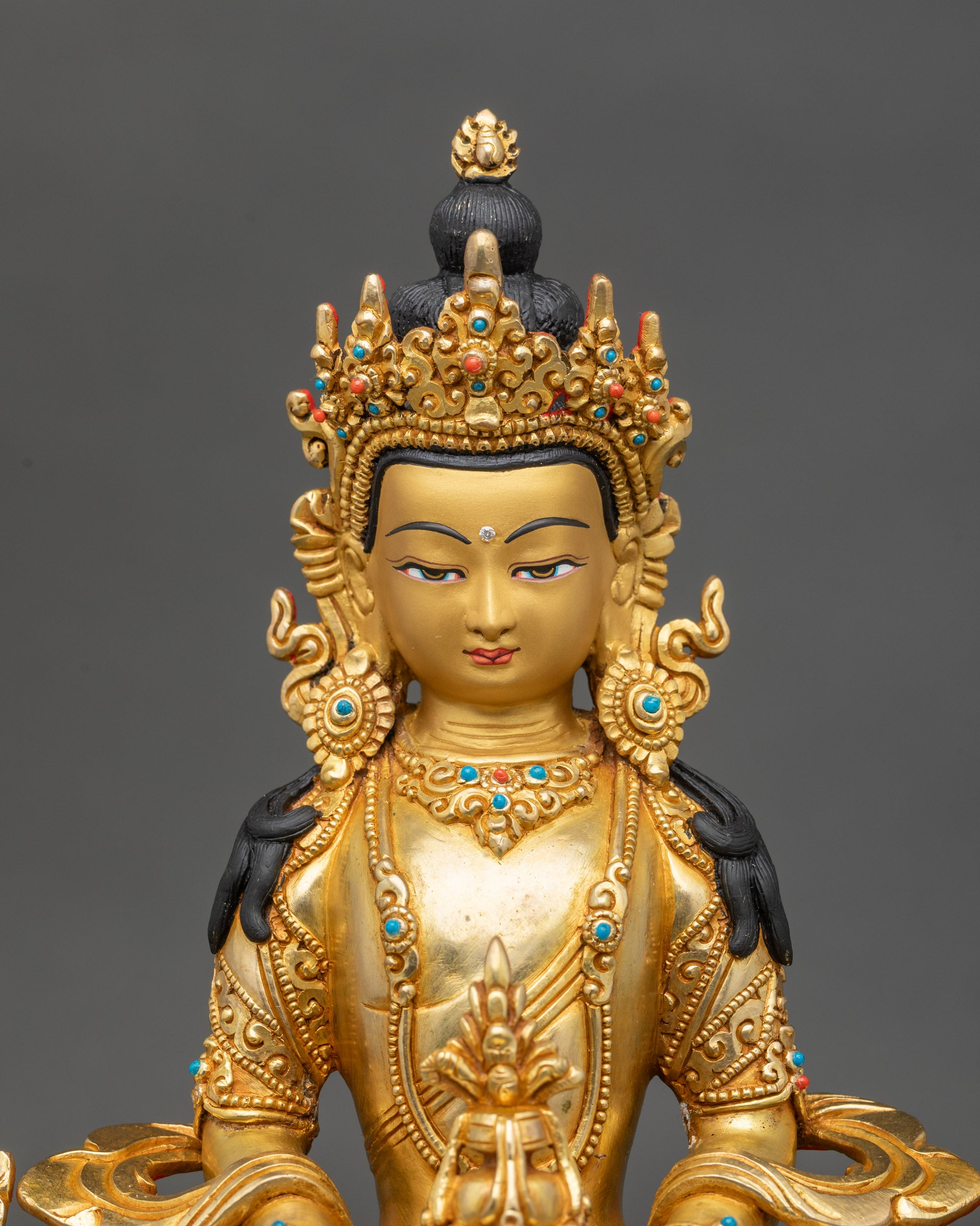 Close-up of Amitayus holding medicinal vase, detailed Newari craftsmanship from Patan