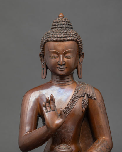 Close-up of Amoghasiddhi Buddha face showing intricate Newari artisan details