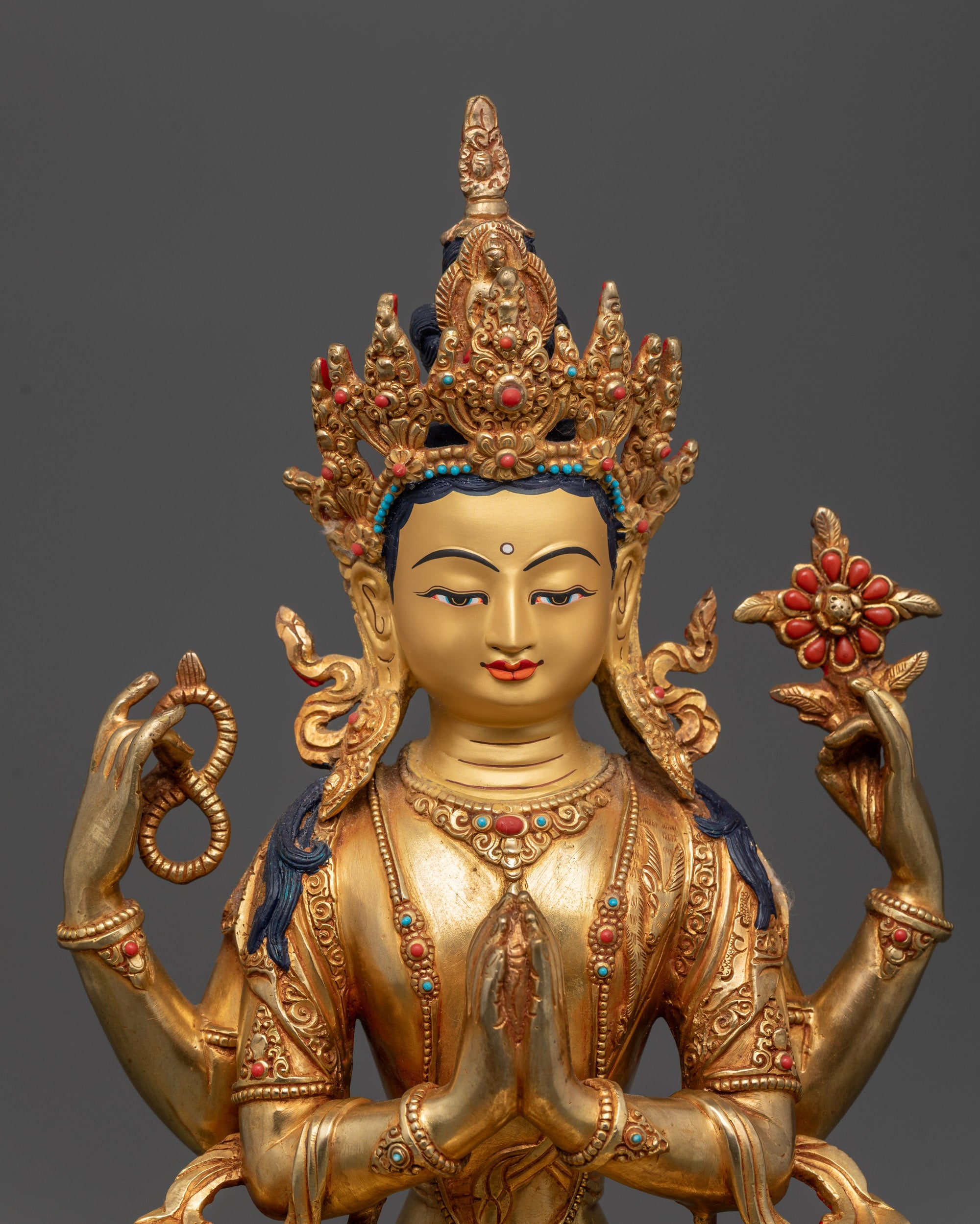 Close-up of Avalokiteshvara Chenrezig Statue highlighting facial features, four arms