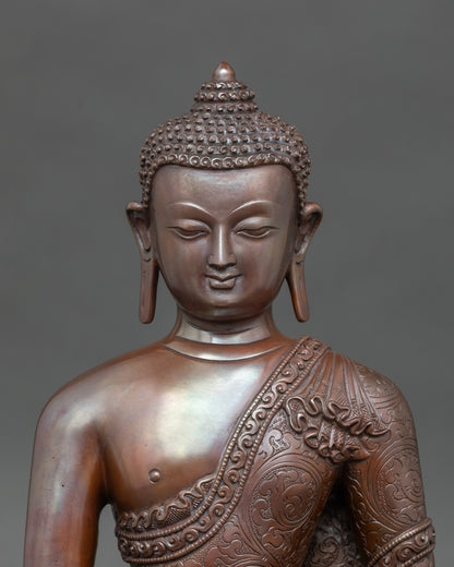 Close-up of Buddha Shakyamuni face with serene expression, chemically oxidized finish