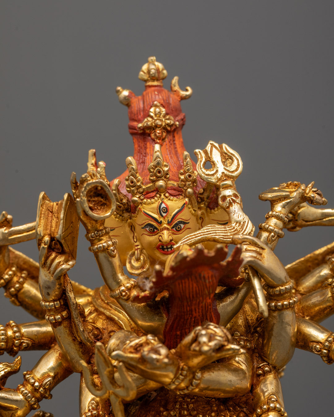 Close-up of Chakrasamvara fierce face and third eye, detailed lost wax carving