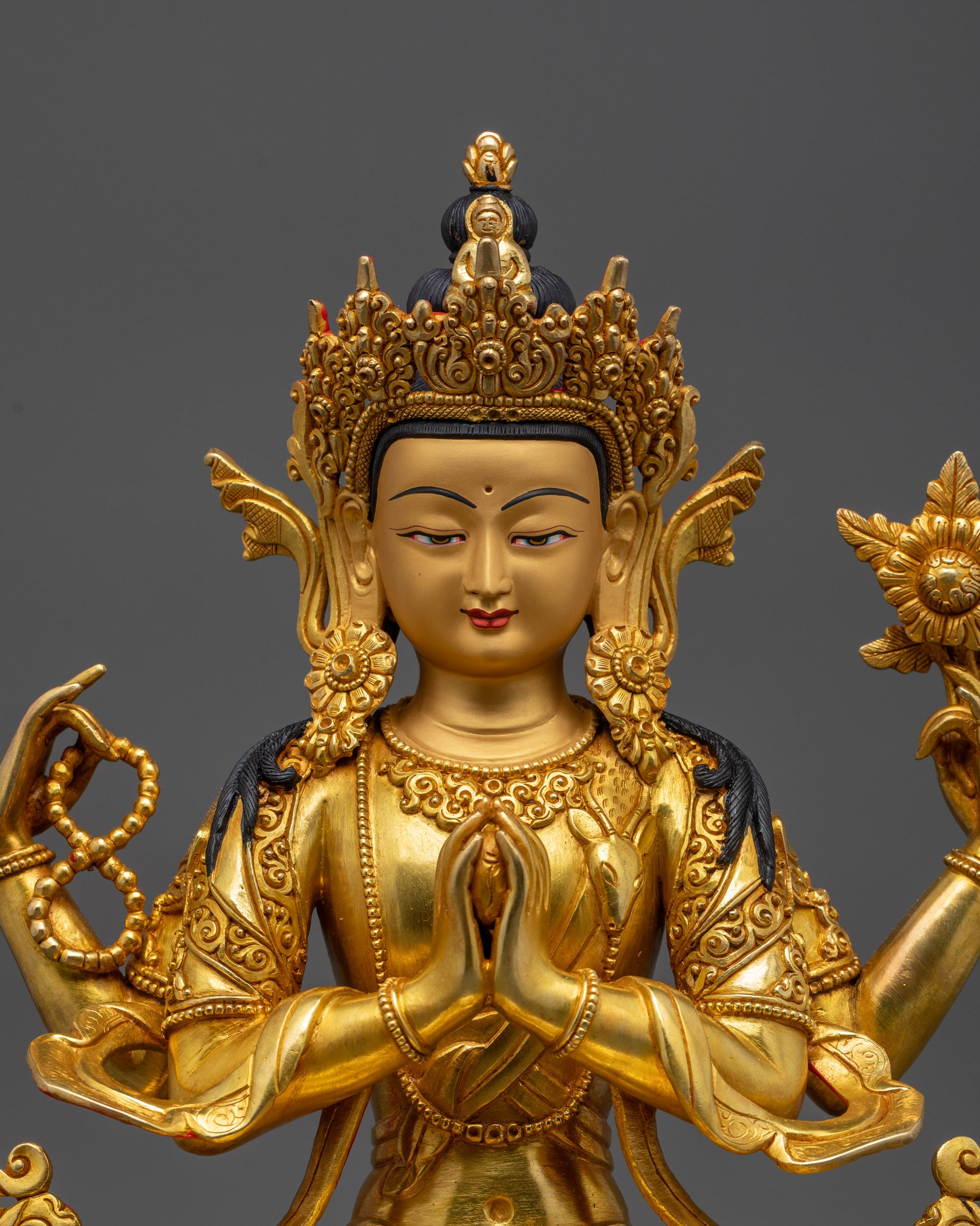 Close-up of Chenrezig Statue five-jeweled crown and intricate robe details