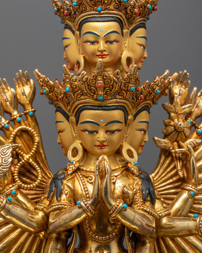 Close-up of Chenrezig's serene face and multiple hands holding sacred symbols