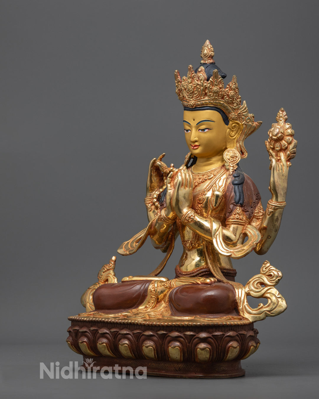 Chenrezig’s serene gold-gilded face, showcasing intricate features and the compassionate expression of Avalokiteshvara.
