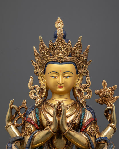 Chenrezig statue’s serene face with detailed multi-colored acrylic painting and intricate craftsmanship from Nepal.