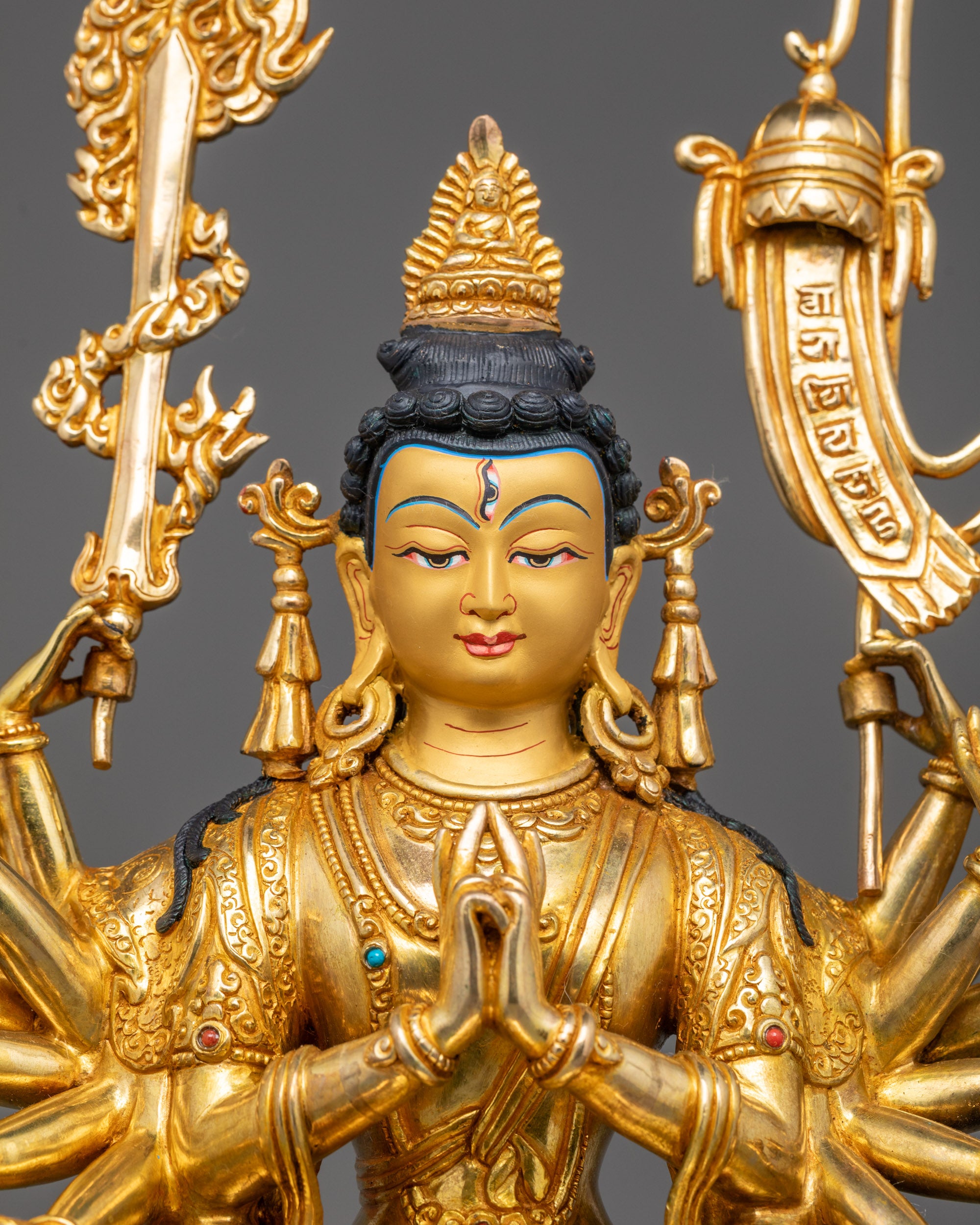Close-up of Chundi Statue Featuring Intricate Details and Sacred Implements