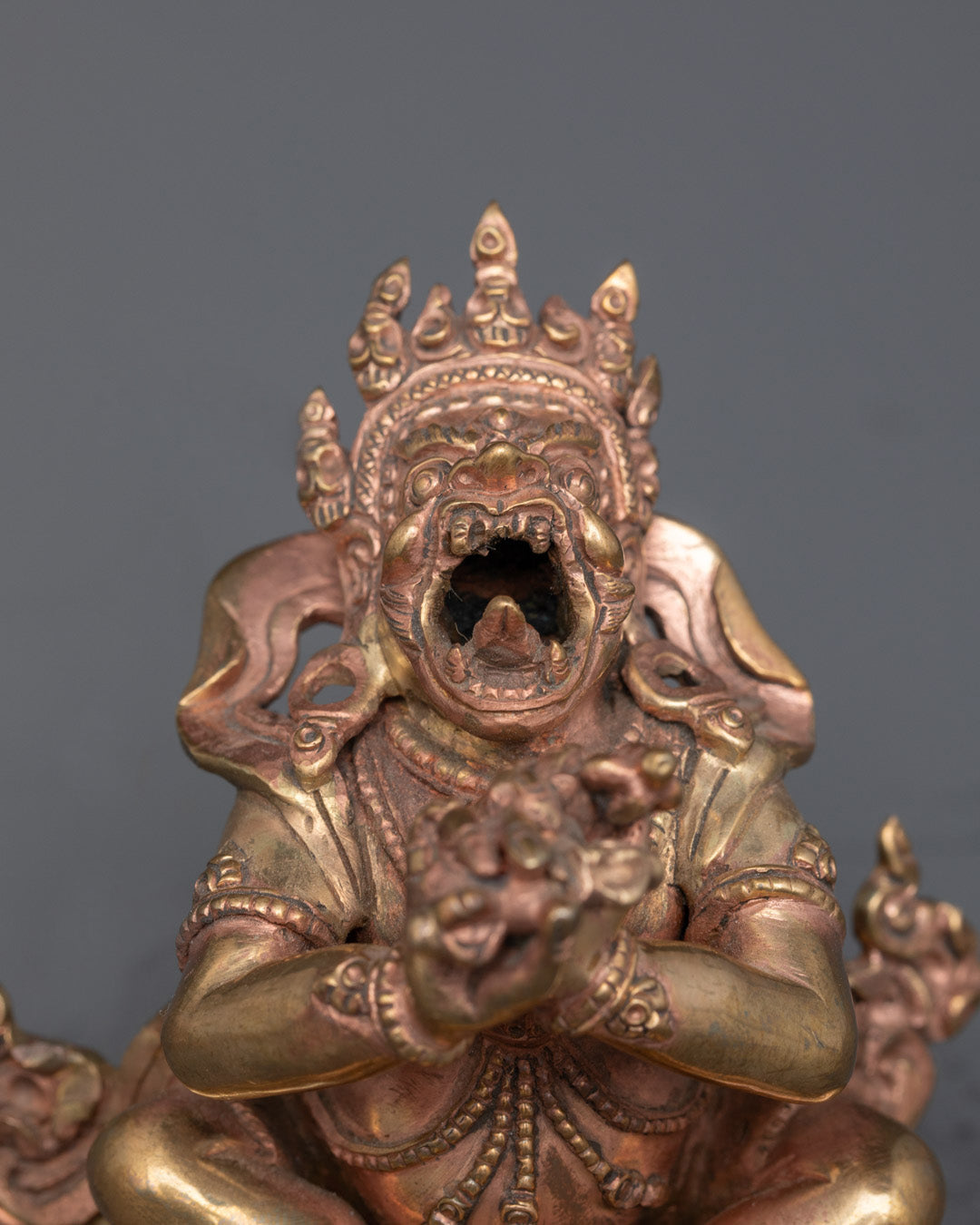 Close-up of Dorje Khadro face with 24k gold gilding and expressive craftsmanship