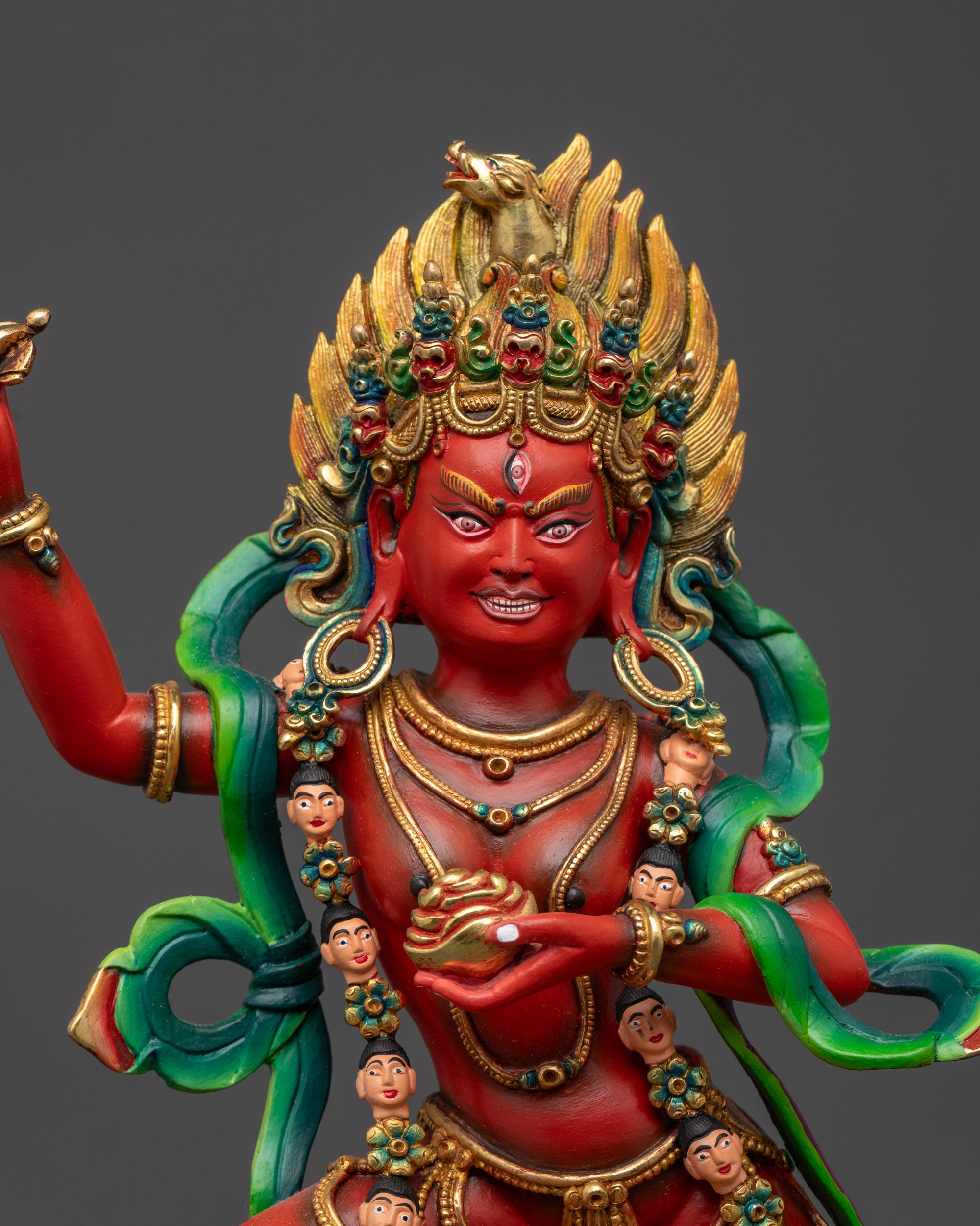 Close-up of Dorje Phagmo’s radiant red form with five-skull crown and fire-gilded gold halo