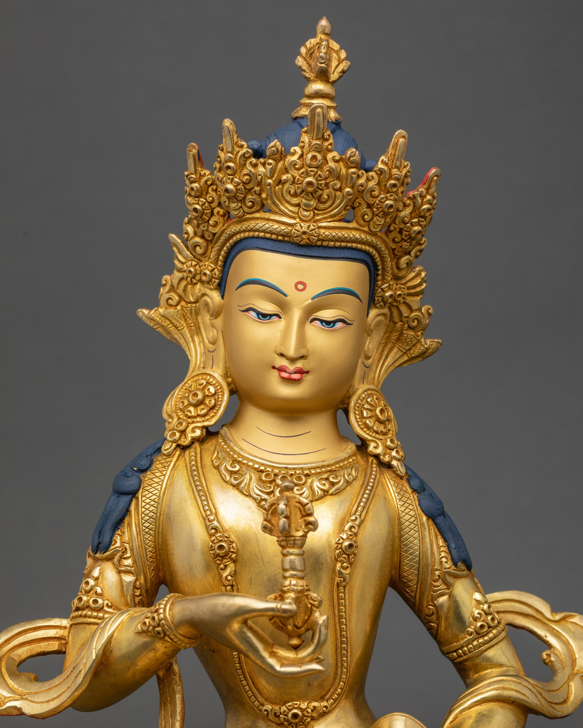 Close-up of Dorje Sempa statue showing intricate floral carvings on garments
