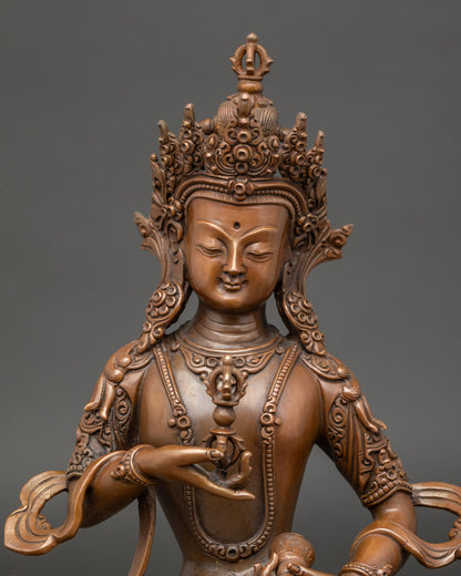 Close-up of Dorje Sempa statue showing vajra at heart and bell at hip details