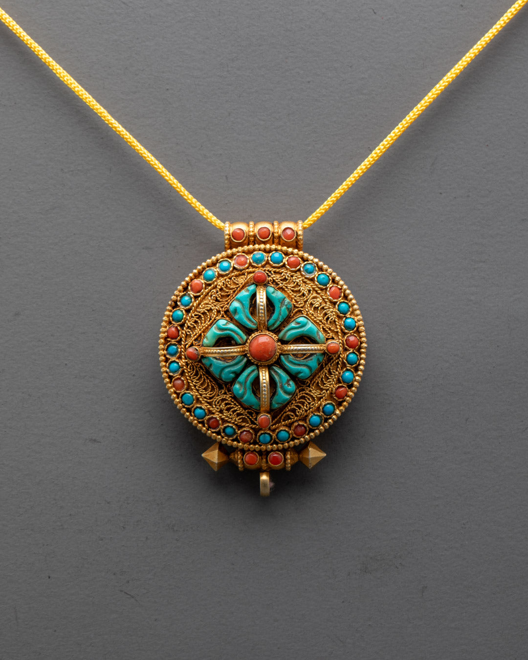 Close-up of Double Dorje design on Bishwo Vajra Locket