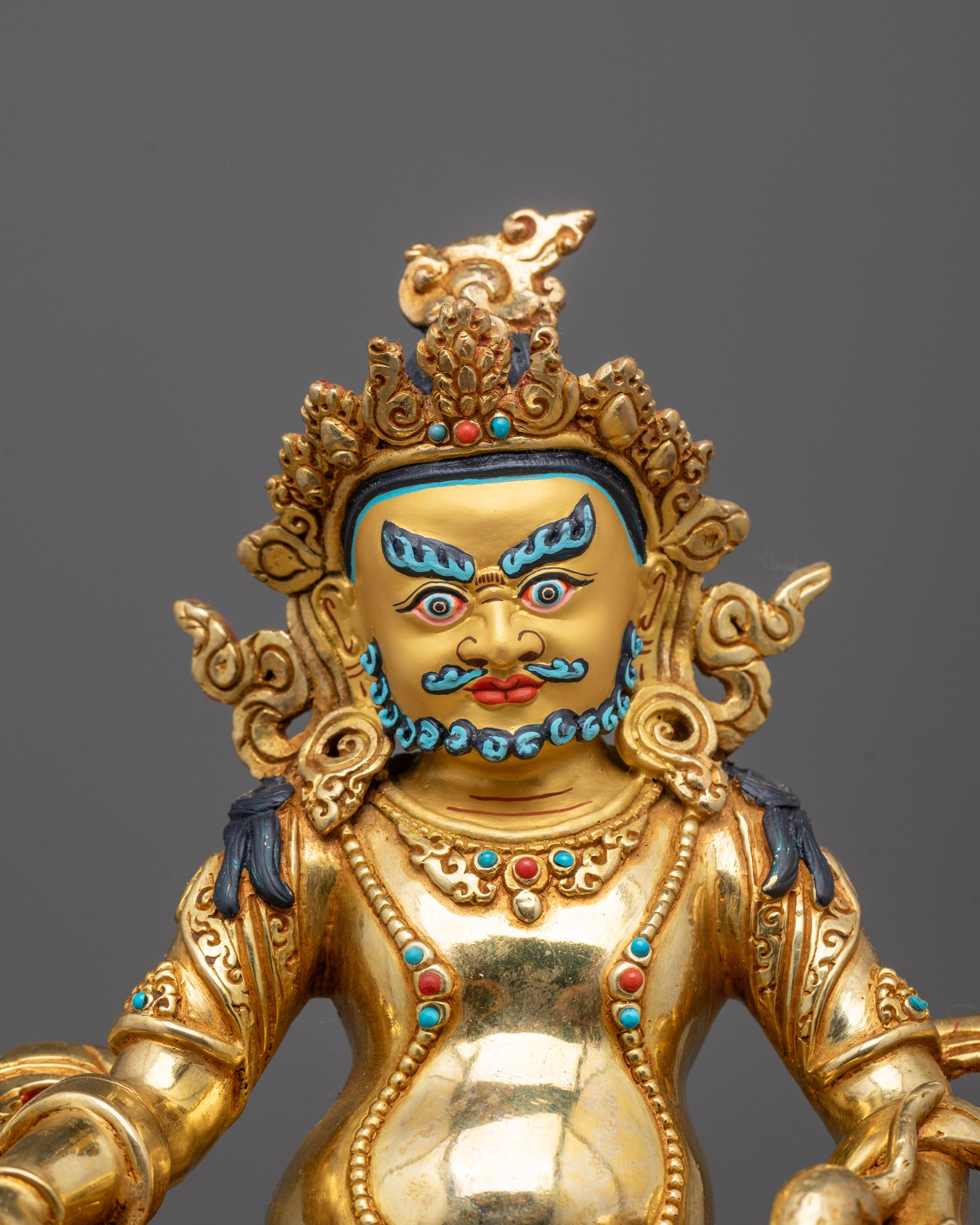 Close-up of Dzambhala Face and Crown | Detailed view of Dzambhala’s serene face