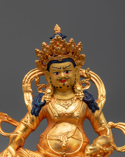 Close-up of Dzambhala Statue featuring intricate gold-plated details