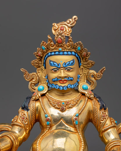 Close-up of Dzambhala Statue holding jewel-spitting mongoose, detailed craftsmanship