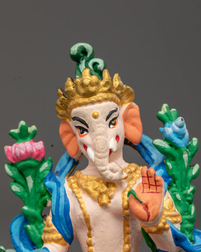 Ganesh's serene face with hand-painted acrylic colors and gold accents, symbolizing intellect, spiritual growth, and obstacle removal.