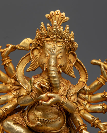 Ganesha's face showing intricate detailing and traditional fire-gilded finish by Nepalese artisans.