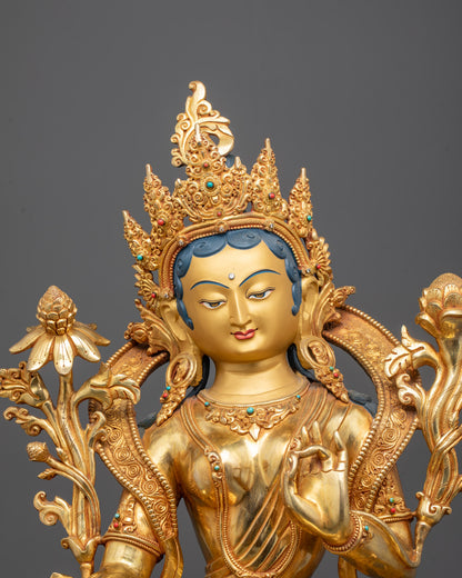 Close-up of Goddess Green Tara’s gold-gilded face and 5-jeweled crown

