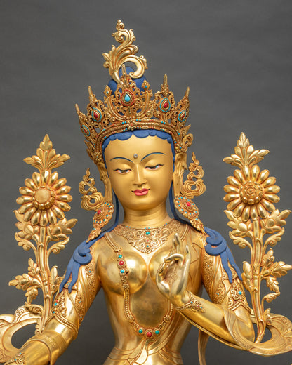 Close-up of Green Tara Bodhisattva, detailed copper and gold finish