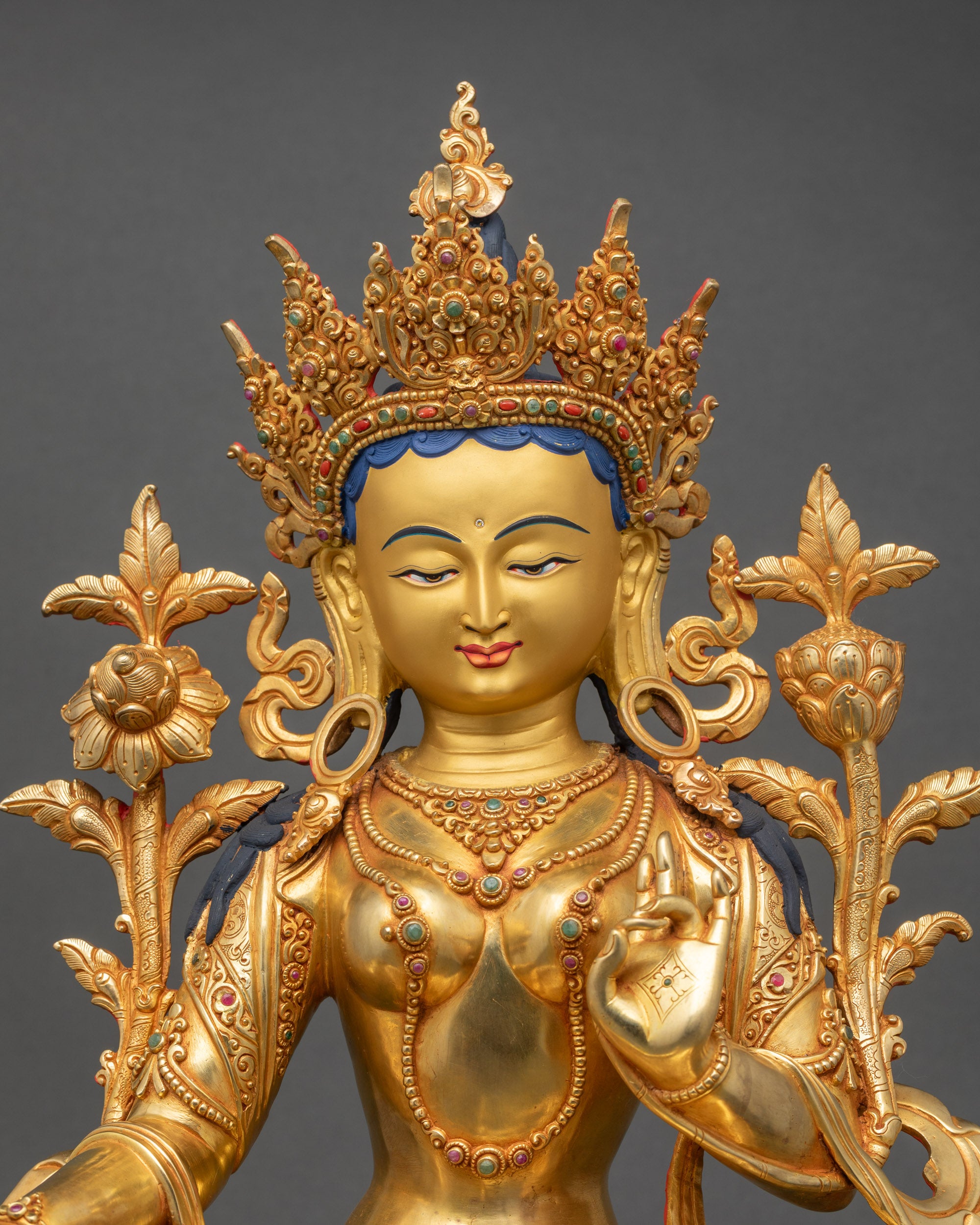 Close-up of Green Tara Droljang statue showing intricate copper and gold details