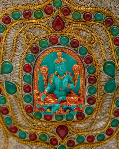Close-up of Green Tara figurine and auspicious symbols on Nepalese Himalayan Vase radiating blessings, purity, and sacred energy.