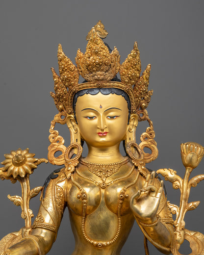 Close-up of Green Tara’s compassionate face with blue lotus