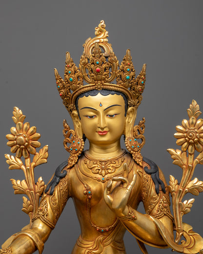 Close-up of Green Tara’s peaceful face and ornate crown
