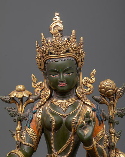Close-up of Green Tara's serene Colored face and jeweled crown