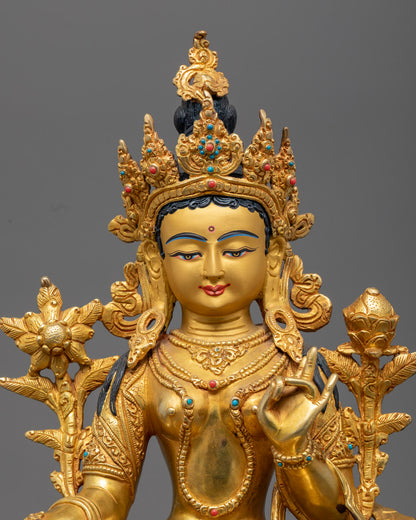 Close-up of Green Tara's serene expression and intricate halo, showcasing detailed craftsmanship.