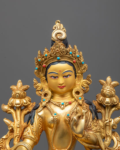 Close-up of Green Tara’s serene face adorned with a finely detailed crown and radiant