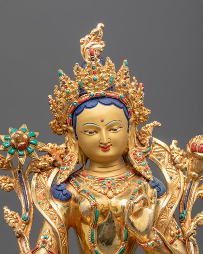 Close-up of Green Tara’s serene face and lotus flower symbol