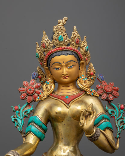 Close-up of Green Tara's serene face with 24k gold fire gilding