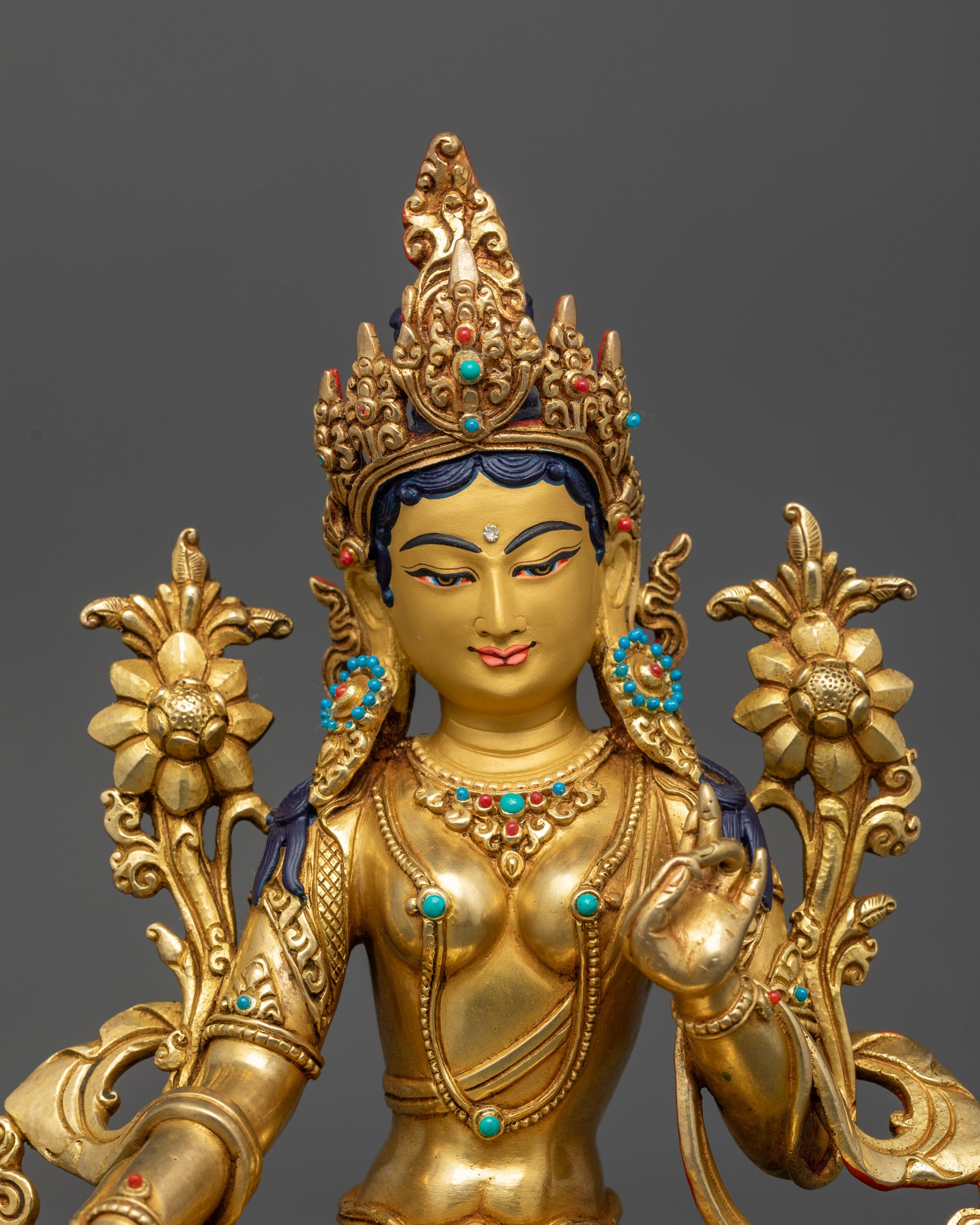 Close-up of Green Tara statue's Five-Jeweled Crown and semi-precious stones
