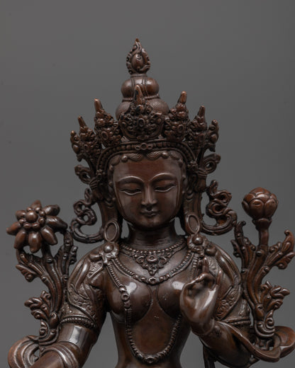 Close-up of Green Tara statue’s oxidized copper face showing detailed electroplated finish