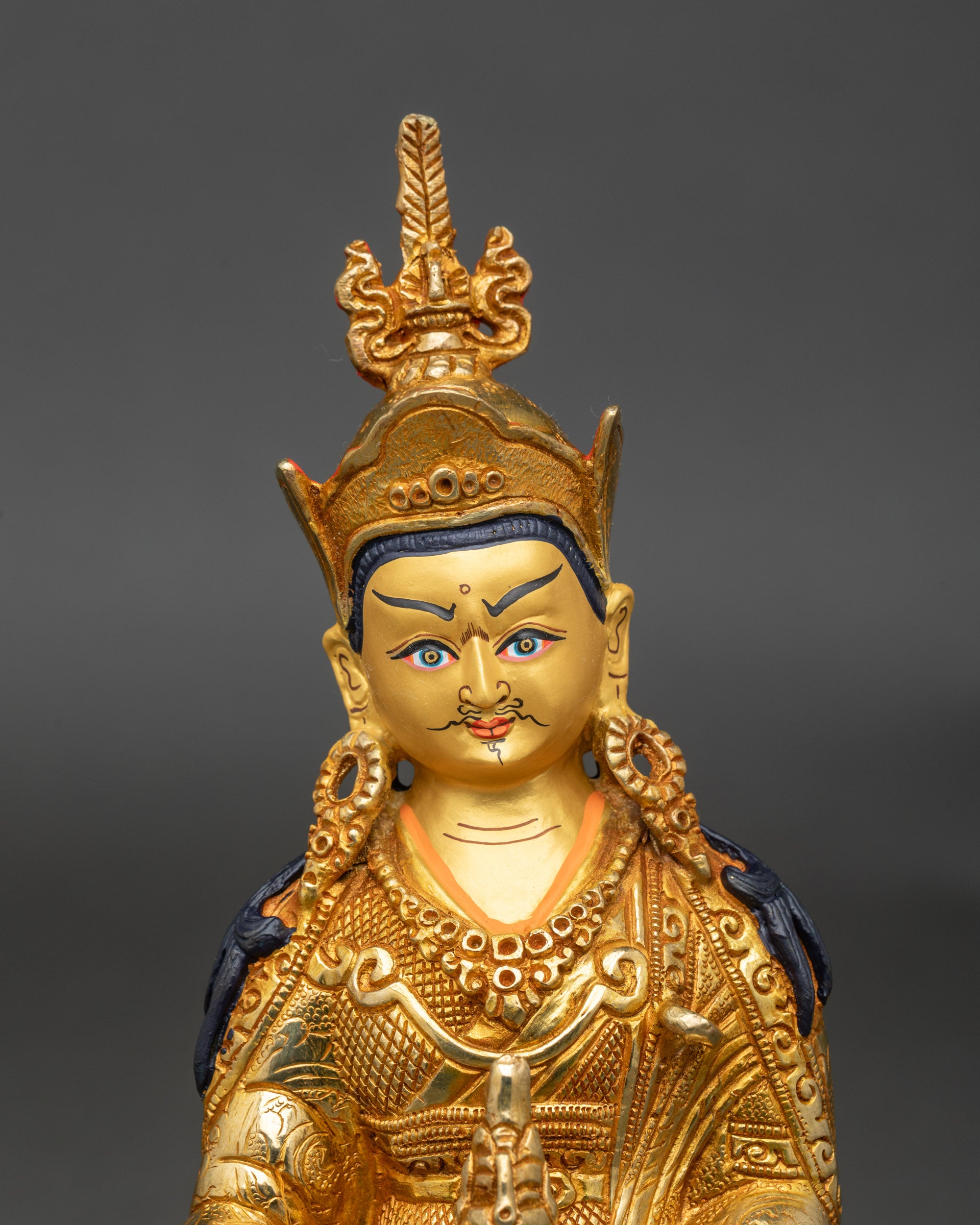 Close-up of Guru Rinpoche meditation statue, 24k gold-painted face, Newari craftsmanship