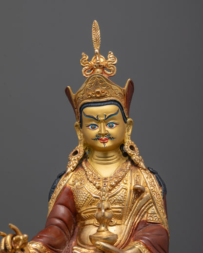 Close-up of Guru Rinpoche’s face, lotus hat, and intricately carved sacred halo