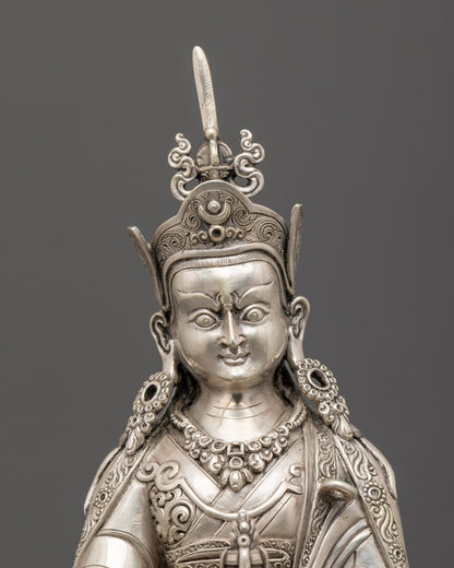 Guru Rinpoche’s serene face with acrylic-painted details and traditional Tibetan ornaments