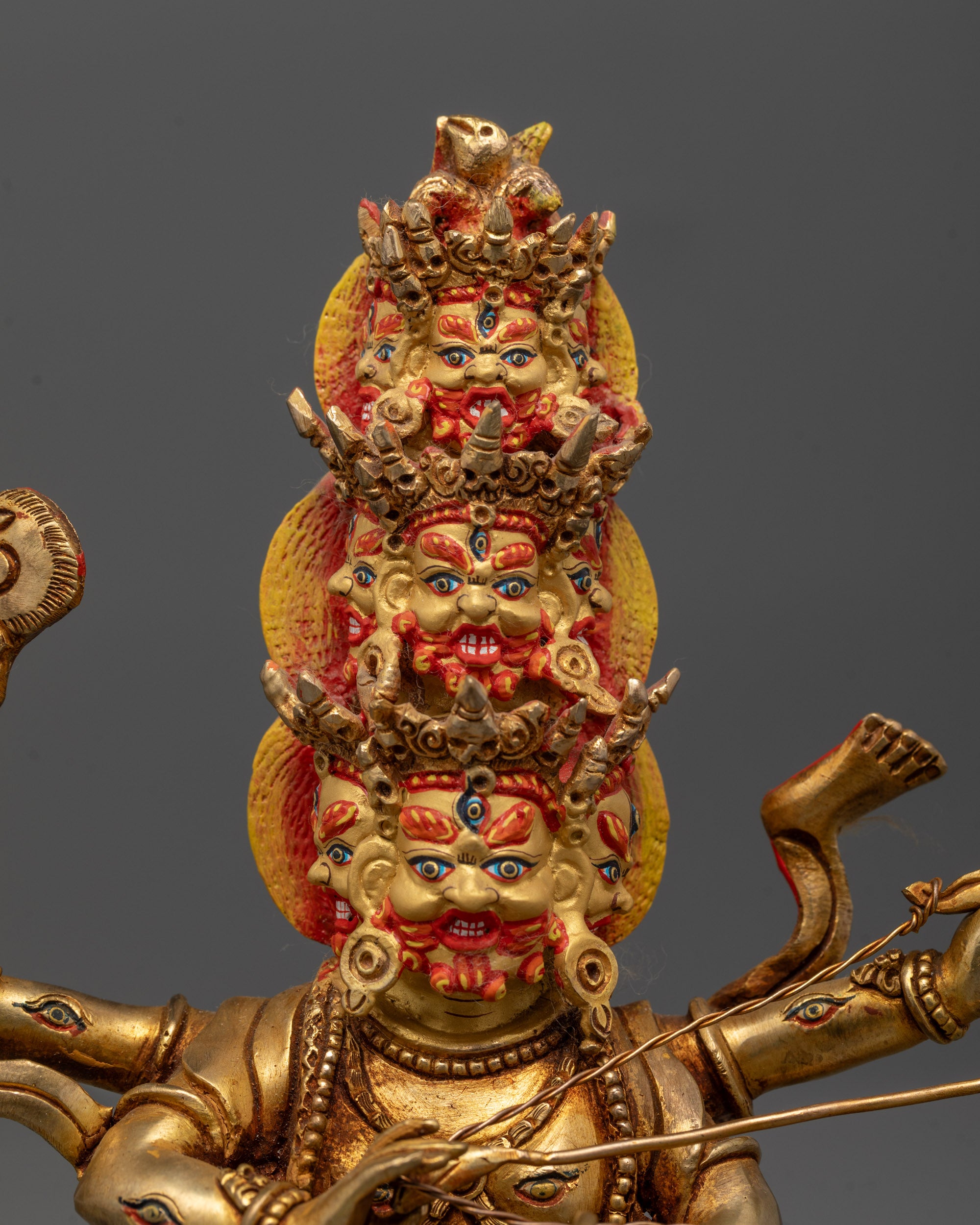 Close-up of Hand-Carved Rahula Statue with 24k Gold Gilding and Nine Fierce Faces