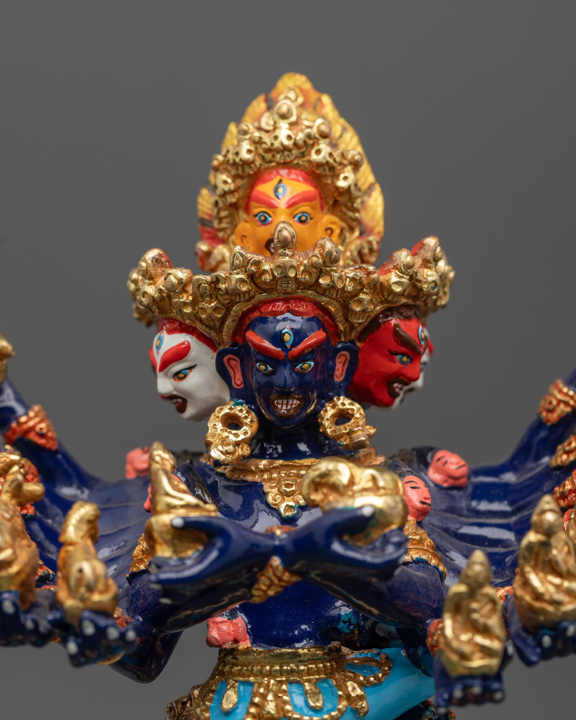 Close-up of Hevajra's fierce expression and symbolic ornaments