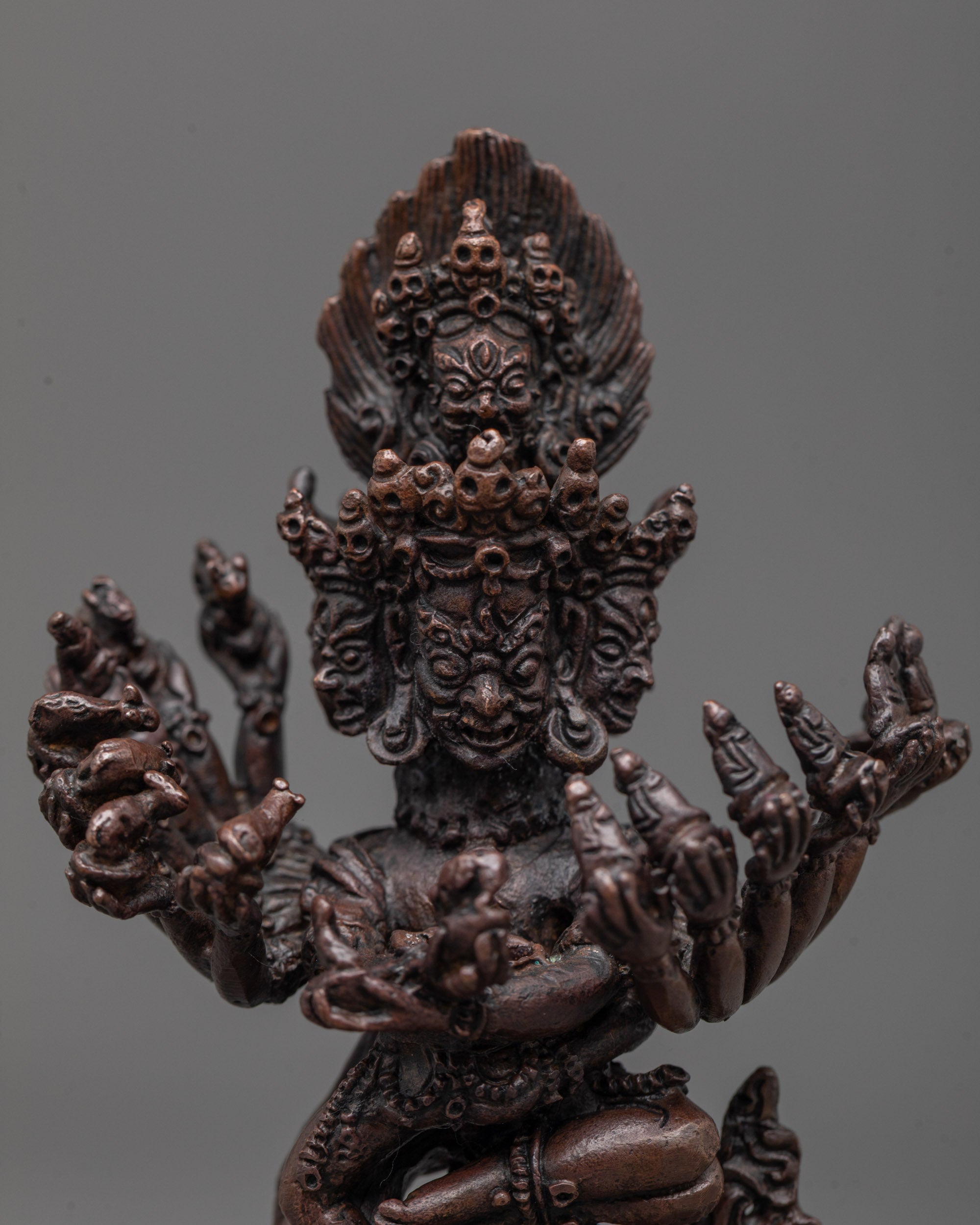 Close-up of Hevajra’s fierce facial expression and intricate ornaments symbolizing wrathful